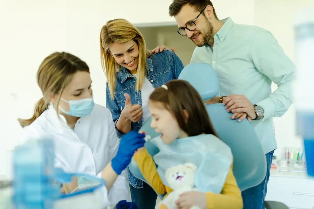 A family at the dentist with a child